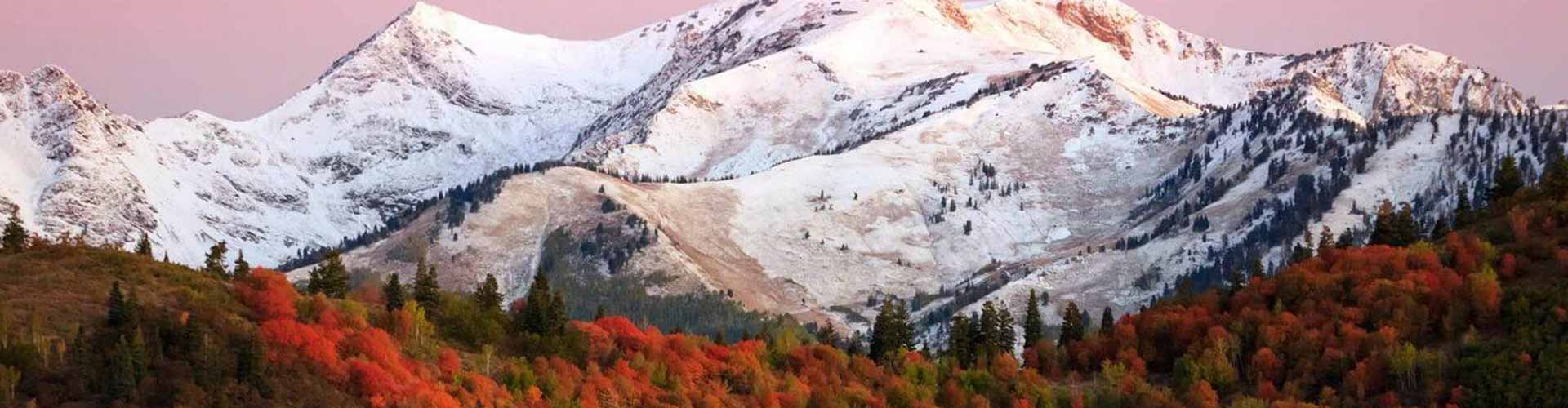 a mountain range with mountains with Summit Slopes luxury transportation.
